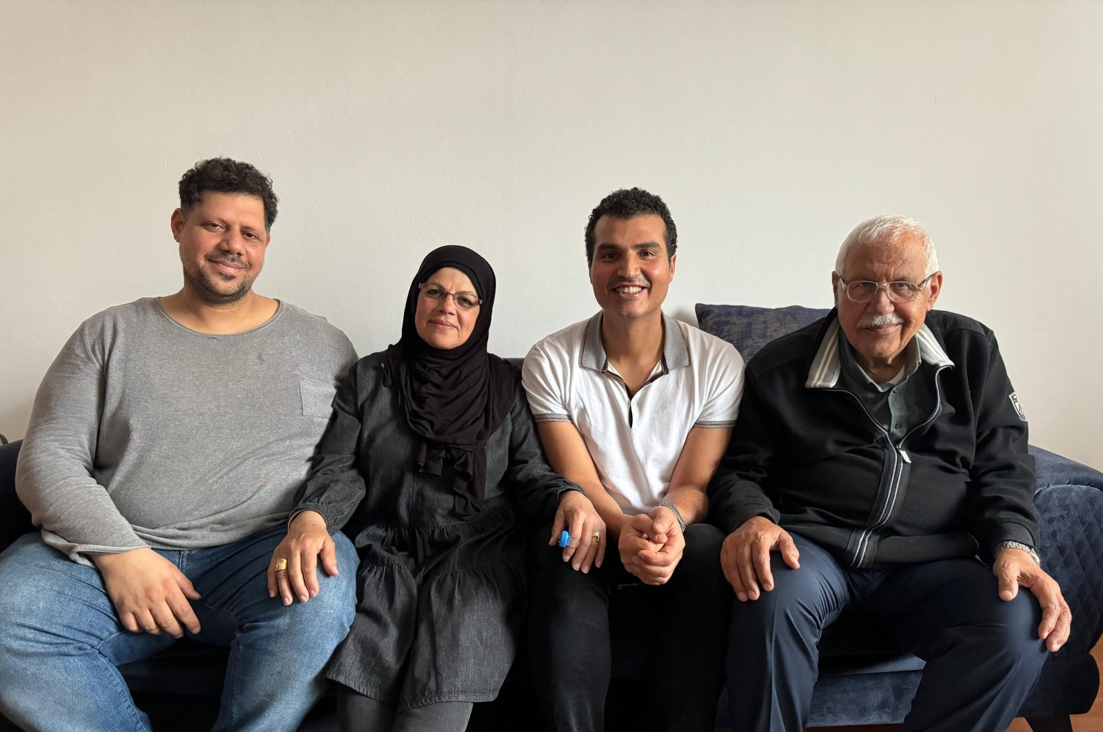 Loay Elbasyouni (C) poses with his parents (2nd L, R) in Istanbul, Türkiye, Feb. 13, 2024. (AA Photo)