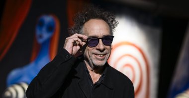 The American filmmaker Tim Burton smiles during a press conference for &quot;The World of Tim Burton&quot; exhibition opening, Turin, Italy, Oct. 10, 2023. (Getty Images Photo)