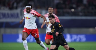Real Madrid's Brahim Diaz (R) and Leipzig's Mohamed Simakan vie for the ball during the UEFA Champions League Round of 16, first-leg football match, Leipzig, Germany, Feb. 13, 2024. (AFP Photo)