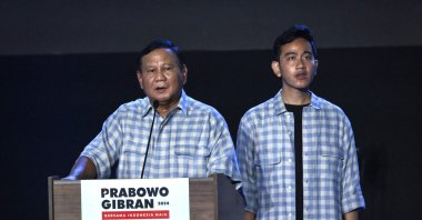 Presidential candidate and Indonesia’s Defence Minister Prabowo Subianto (Left) speaks on the stage with vice presidential candidate Gibran Rakabuming Raka, Indonesian President Joko Widodo's son and current Surakarta City mayor, during their gathering with supporters after polls closed in the country’s presidential and legislative elections in Jakarta on Feb.14, 2024. (AFP Photo)