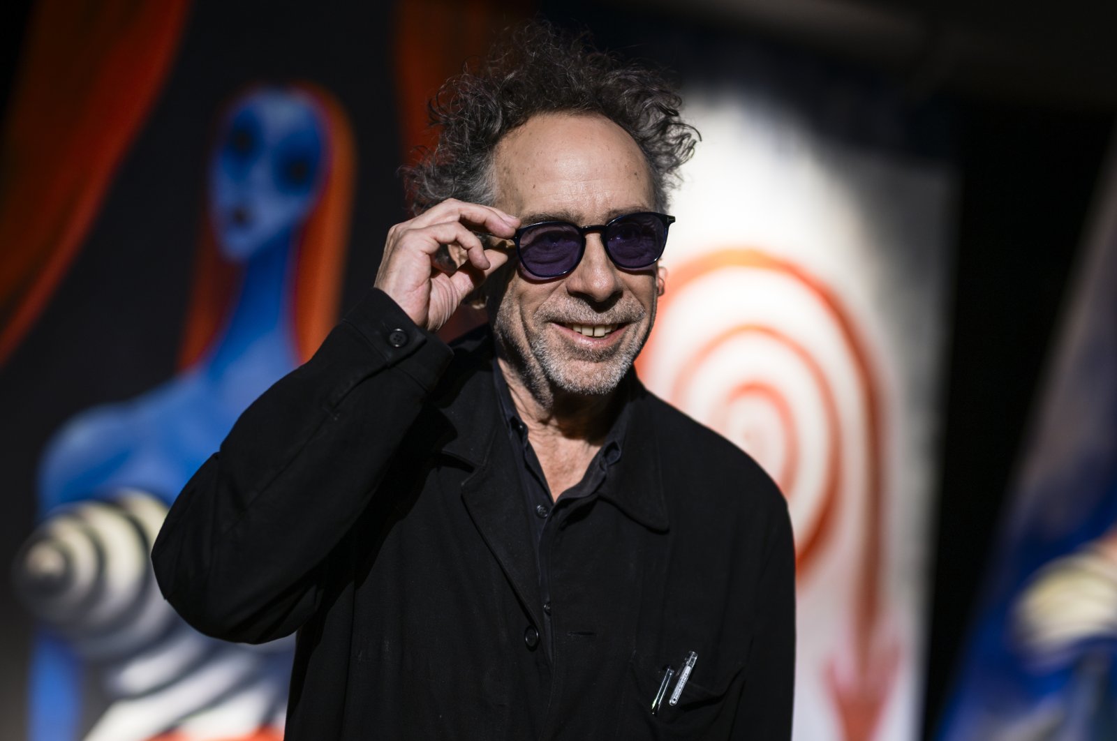 The American filmmaker Tim Burton smiles during a press conference for &quot;The World of Tim Burton&quot; exhibition opening, Turin, Italy, Oct. 10, 2023. (Getty Images Photo)