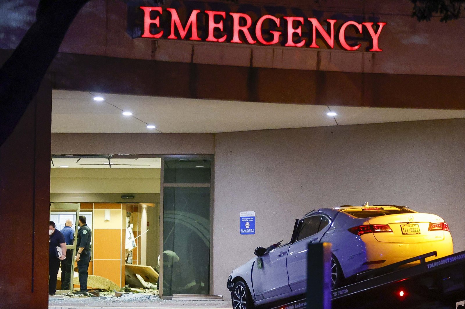 A tow truck removes the car that crashed into the emergency room at St. David&#039;s North Austin Medical Center in Austin, Texas, U.S., Feb. 13, 2024. (EPA Photo)