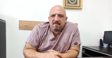 Dr. Seçkin Akküçük, who treated the Turkish woman for &quot;Rapunzel syndrome,&quot; poses for a photo in his office, Osmaniye, Türkiye, Feb. 15, 2024. (AA Photo)