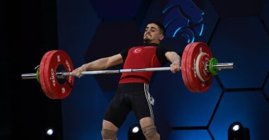Türkiye&#039;s Kaan Kahriman in action during the men&#039;s 67 kg. category at the 2024 EWF European Weightlifting Championships, Sofia, Bulgaria, Feb. 14, 2024. (EPA Photo)