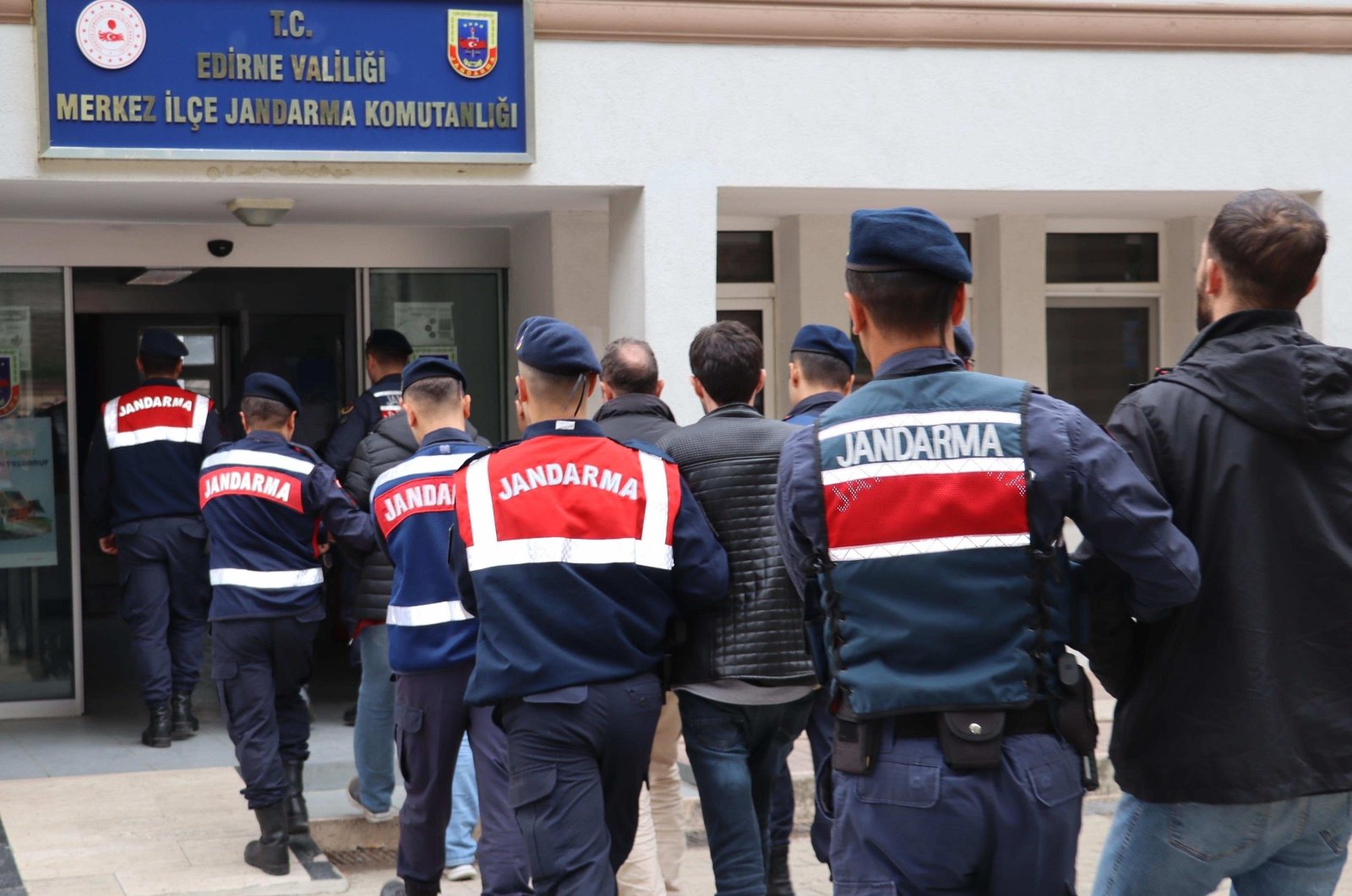 Turkish gendarmerie forces escort nine Gülenist Terror Group (FETÖ) suspects caught on the border in the northwestern Edirne province while trying to flee abroad, Türkiye, Feb. 5, 2024. (AA Photo)