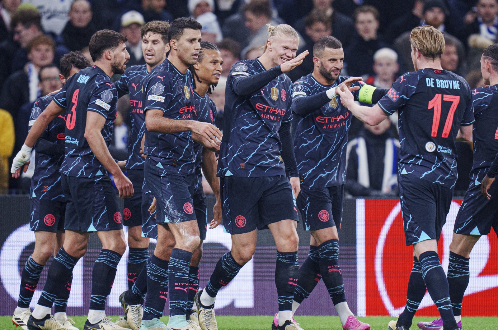 Manchester City players celebrate their side&#039;s second goal during the Champions League, round of 16 first leg match against Copenhagen, Copenhagen, Denmark, Feb. 13, 2024. (AP Photo)