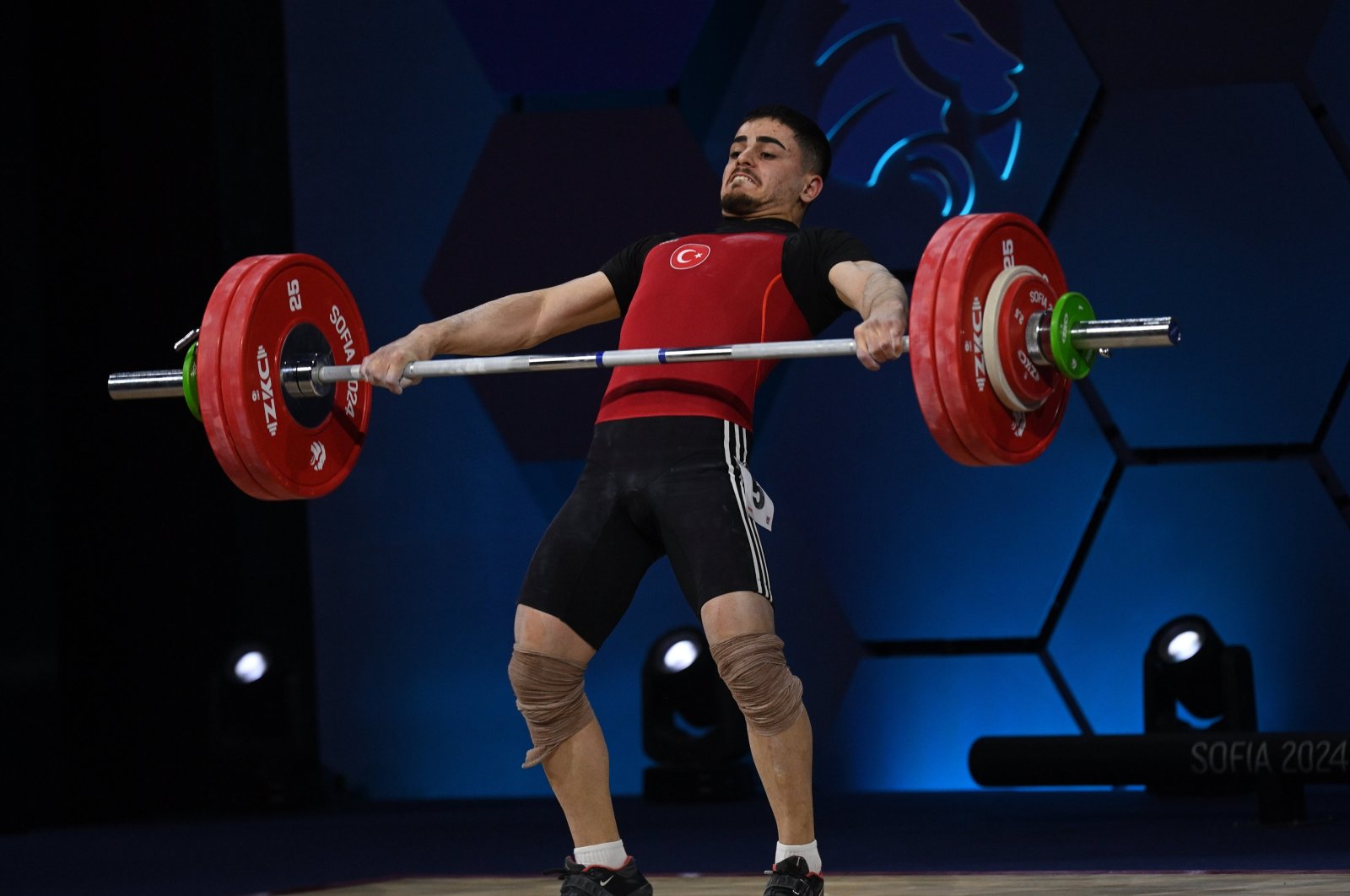 Türkiye&#039;s Kaan Kahriman in action during the men&#039;s 67 kg. category at the 2024 EWF European Weightlifting Championships, Sofia, Bulgaria, Feb. 14, 2024. (EPA Photo)