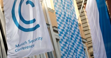 A flag carrying the logo of the 60th Munich Security Conference (MSC) flies in front of a hotel, Munich, Germany, Feb. 15, 2024. (EPA Photo)