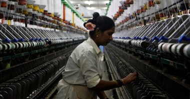 A woman works at a textile mill in Mumbai, India, March 8, 2018. (Reuters Photo) 