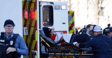A person is loaded onto an ambulance following a shooting at Union Station during the Kansas City Chiefs Super Bowl LVIII victory parade, Kansas City, U.S., Feb. 14, 2024. (AFP Photo)