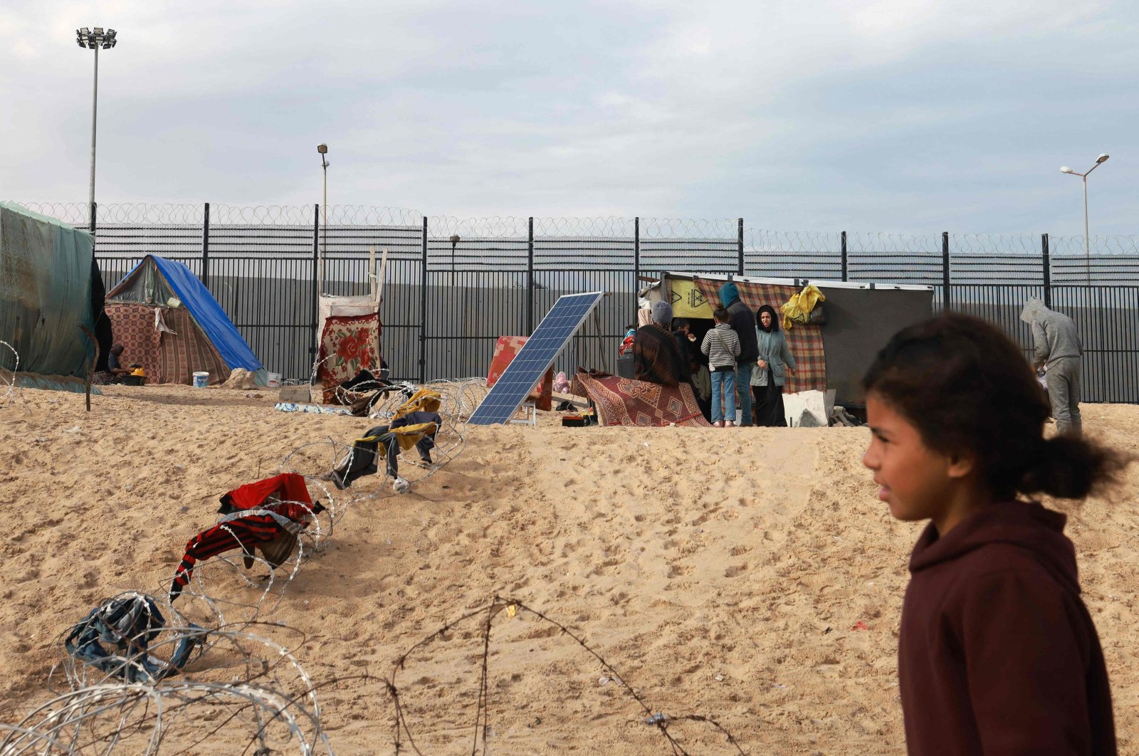 Palestinians shelter at the border with Egypt, amid fears of an exodus of Palestinians into Egypt, as the conflict between Israel and Hamas continues, Rafah, Palestine, Feb. 16, 2024. (Reuters Photo)