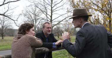 This image released by Universal Pictures shows actor Emily Blunt (L), with writer-director-producer Christopher Nolan, center, and actor Cillian Murphy on the set of &quot;Oppenheimer.&quot; (AP Photo)