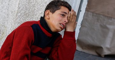 A boy mourns the death of his loved ones in Israeli attacks on Rafah, southern Gaza Strip, Palestine, Feb. 18, 2024. (Reuters Photo)
