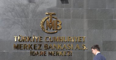 A man walks in front of the headquarters of the Central Bank of the Republic of Türkiye (CBRT), Ankara, Türkiye, Feb. 8, 2024. (EPA Photo)