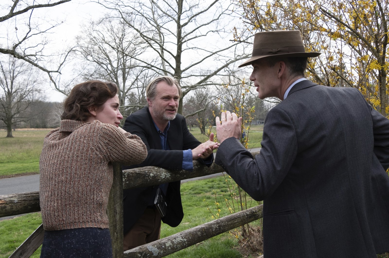 This image released by Universal Pictures shows actor Emily Blunt (L), with writer-director-producer Christopher Nolan, center, and actor Cillian Murphy on the set of &quot;Oppenheimer.&quot; (AP Photo)