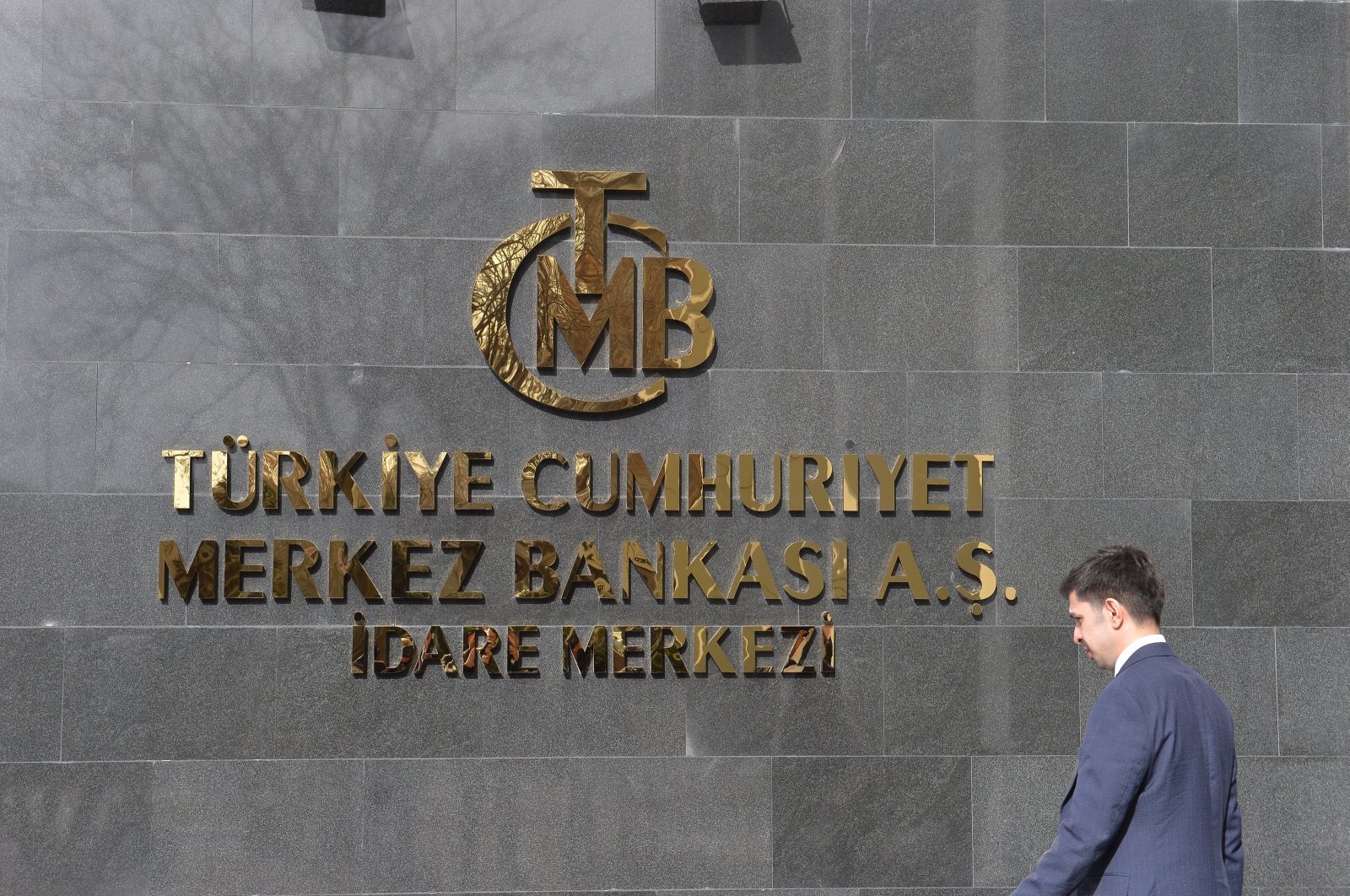 A man walks in front of the headquarters of the Central Bank of the Republic of Türkiye (CBRT), Ankara, Türkiye, Feb. 8, 2024. (EPA Photo)