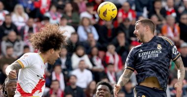 Rayo Vallecano's Aridane Hernandez (L) heads the ball next to Real Madrid's Joselu during the La Liga match at the Vallecas stadium, Madrid, Spain, Feb. 18, 2024. (AFP Photo)