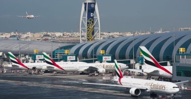 An Emirates jetliner comes in for landing at the Dubai International Airport, Dubai, UAE, Dec. 11, 2019. (AP Photo)