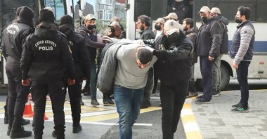 Police escort Daesh suspects detained after the church shooting, in Istanbul, Türkiye, Feb.1, 2024. (DHA Photo)
