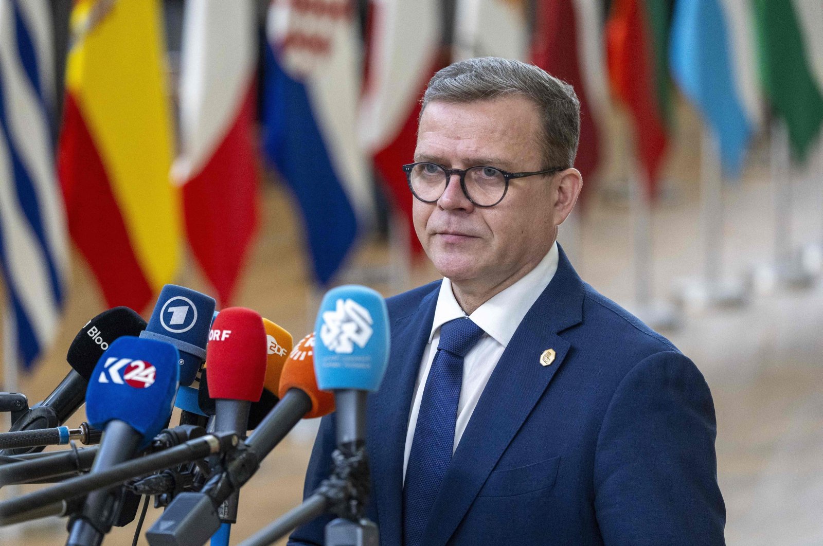 Finland&#039;s Prime Minister Petteri Orpo speaks to the press as he arrives before the start of a European Council meeting at the European headquarters in Brussels, Feb. 1, 2024. (AFP File Photo)