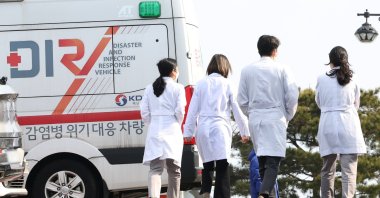 Medical workers walk at a general hospital in Seoul as an association of trainee doctors was seen shifting into cautious mode one day after it set up an emergency committee in protest of a government plan to increase the number of medical students, South Korea, Feb. 13, 2024. (EPA Photo)