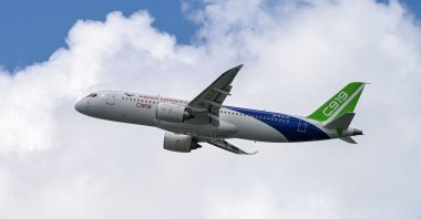 China&#039;s COMAC C919 airplane flies past during the Singapore Airshow, Singapore, Feb. 20, 2024. (AFP Photo)
