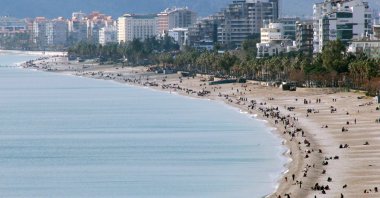 Aerial view of groups of people enjoying warm weather at a beach in Antalya, southern Türkiye, Feb. 18, 2024. (DHA Photo)