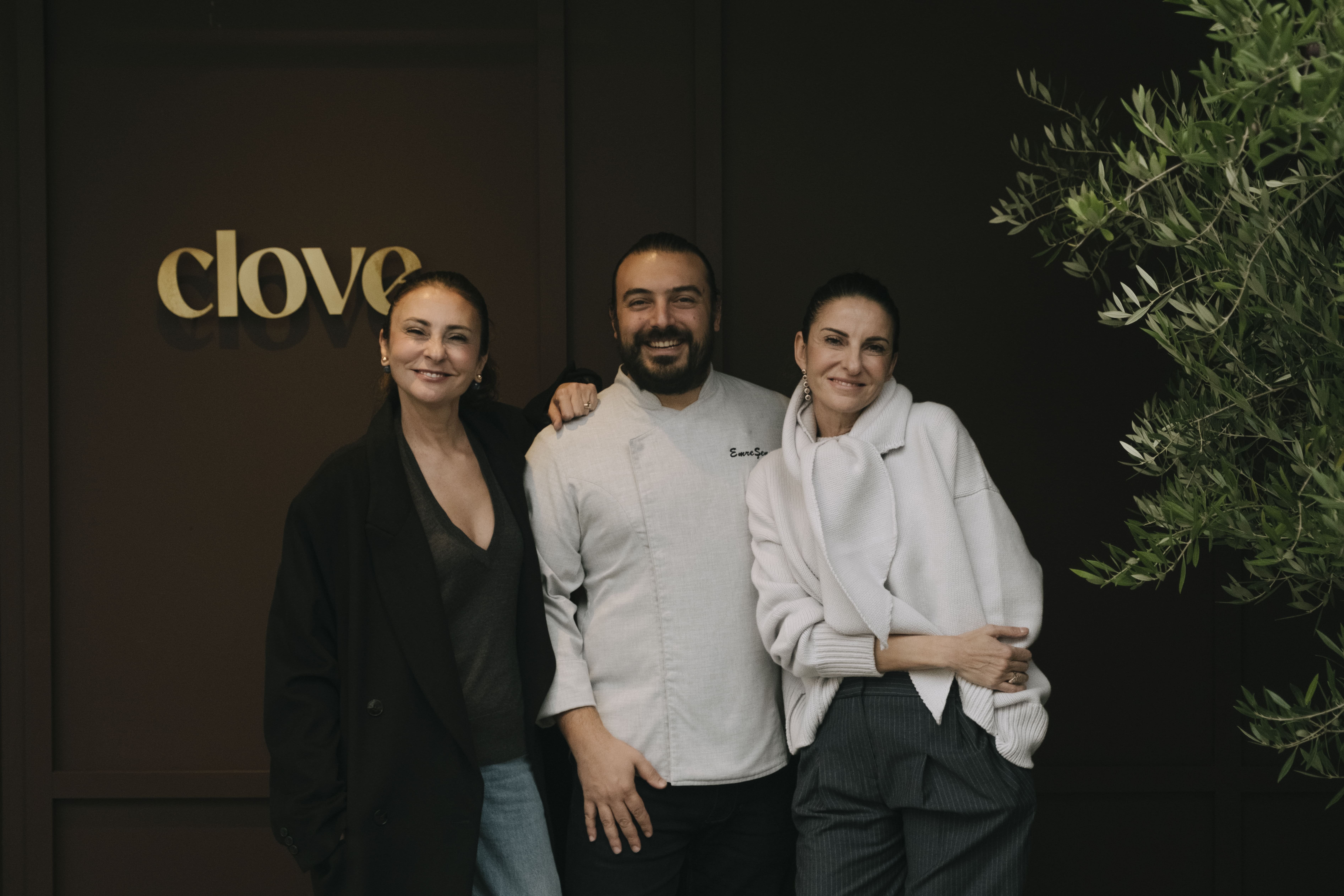 Yaprak Baltacı (L), Emre Şen (C) and Başak Soykan pose for a photo inside Clove, Istanbul, Türkiye.