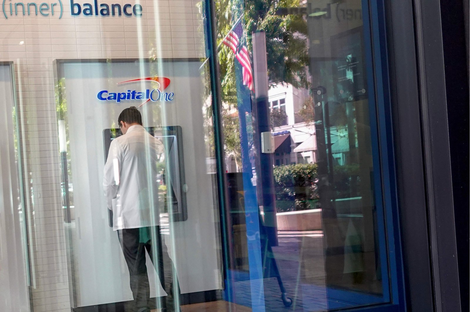 A customer makes a transaction at a Capital One ATM in Miami, Florida, U.S., Feb. 19, 2024. (AFP Photo)