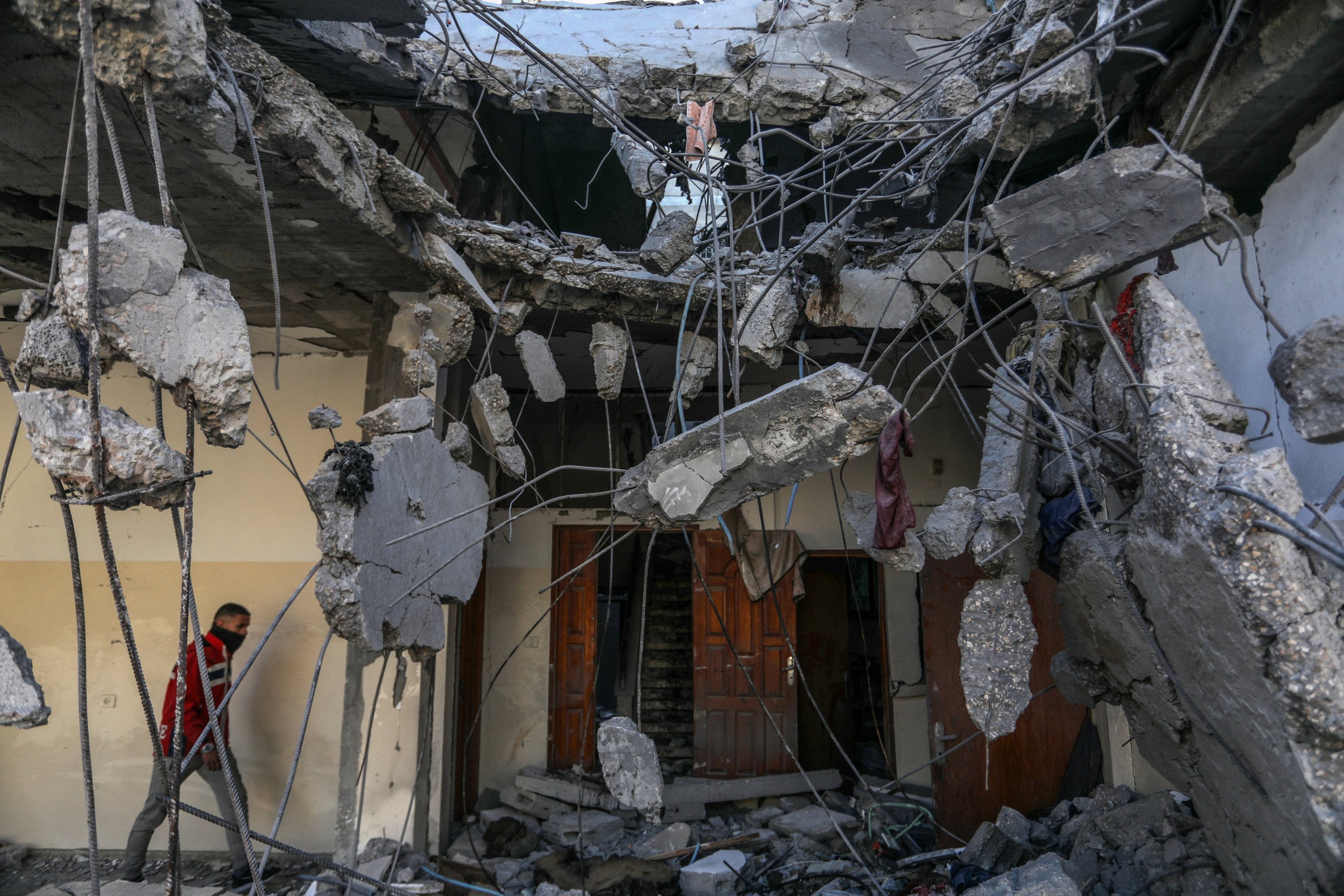 A man examines the rubbles of a house destroyed in Israeli attacks, Rafah, Palestine, Feb. 21, 2024. (AA Photo)