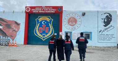Gendarmerie officers escort a convicted FETÖ fugitive to the penitentiary who was caught in eastern Malatya province, Türkiye, Feb. 17, 2024. (IHA Photo)