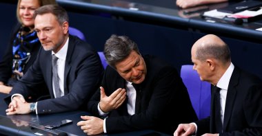 German Chancellor Olaf Scholz (R) listens to German Economy and Climate Minister Robert Habeck (C) as German Finance Minister Christian Lindner (L) looks on during a debate session of the German parliament Bundestag, Berlin, Germany, Jan. 31, 2024. (EPA Photo)