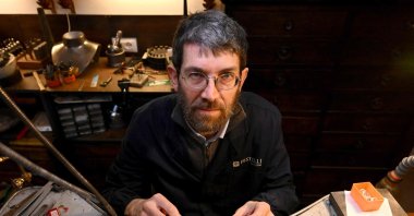 Goldsmith Tommaso Pestelli poses in his new workshop after he was forced to leave the historic one, Florence, Italy, Feb. 15, 2024. (AFP Photo)