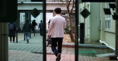 A medical worker walks out the door at Pusan National University Hospital in Busan, South Korea, Feb. 21, 2024. (Reuters Photo)