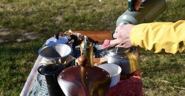 Enes Sefa Ünlü makes coffee on his bicycle coffee shop in Bursa, Türkiye, Feb. 21, 2024. (AA Photo)