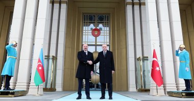 President Recep Tayyip Erdoğan shakes hands with Azerbaijani President Ilham Aliyev (L) at the Presidential Complex, Ankara, Türkiye, Feb. 19, 2024. (AA Photo)
