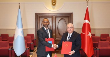 Defense Minister Yaşar Güler (R) shakes hands with his Somali counterpart Abdulkadir Mohamed Nur after signing the defense and economy deal, Ankara, Türkiye, Feb. 8, 2024. (AA Photo)