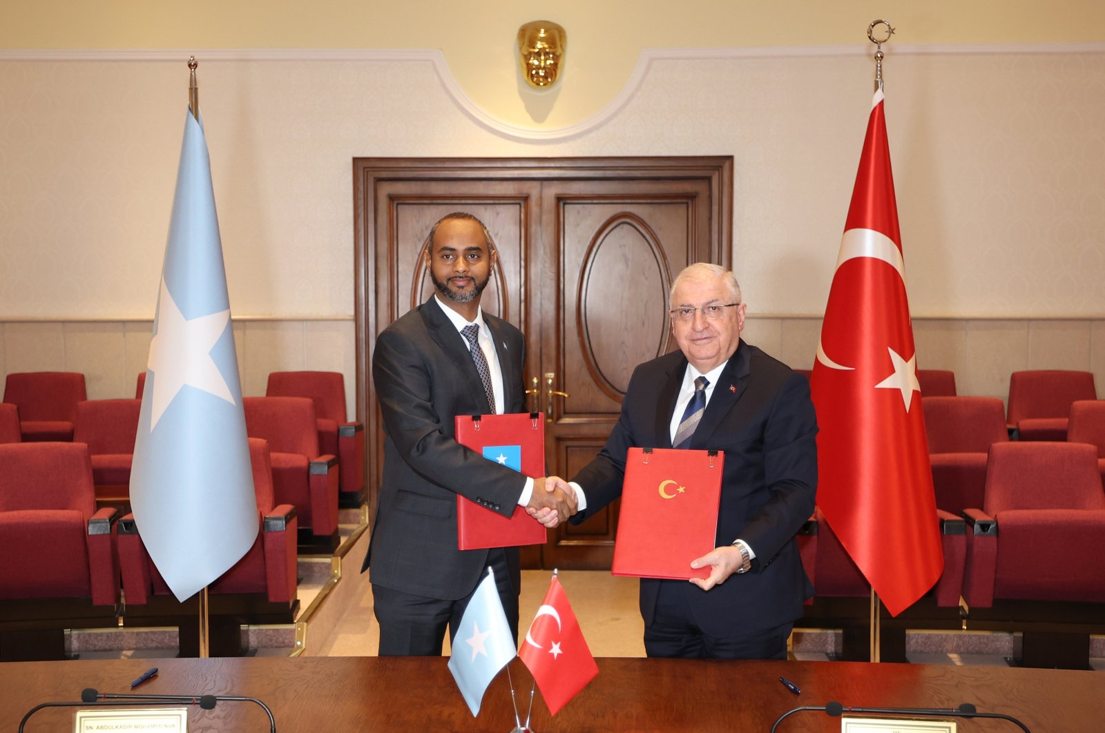 Defense Minister Yaşar Güler (R) shakes hands with his Somali counterpart Abdulkadir Mohamed Nur after signing the defense and economy deal, Ankara, Türkiye, Feb. 8, 2024. (AA Photo)