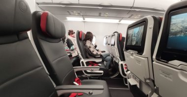 Passengers onboard a Turkish Airlines TK 1843 flight from Istanbul New Airport to Athens, Greece, April 12, 2020. (Getty Images Photo)