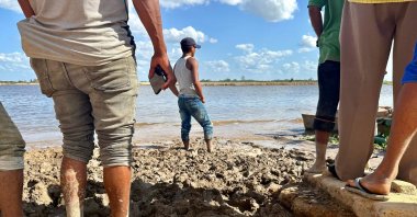Relatives wait to receive the bodies of the miners who died in a mine accident in La Paragua, Venezuela, Feb. 21, 2024. (AFP Photo)
