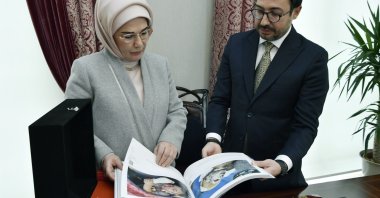First lady Emine Erdoğan selects photos for the contest with Chairperson and General Manager Serdar Karagöz (R), Ankara, Istanbul, Feb. 22, 2024. (AA Photo)