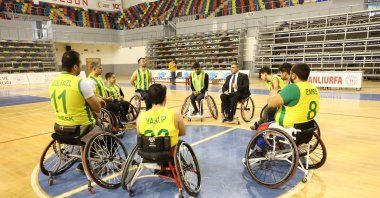 Şanlıurfa Physically Disabled Sports Club (BESK) members speak with the club President Veysi Fırat (4th R), Şanlıurfa, Türkiye, Feb. 22, 2024. (AA Photo)