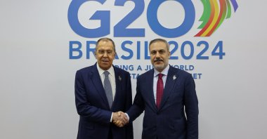 Foreign Minister Hakan Fidan and his Russian counterpart Sergey Lavrov shake hands as they meet at the G-20 Foreign Ministers&#039; meeting in Rio de Janeiro, Brazil, Feb. 22, 2024. (AA Photo)