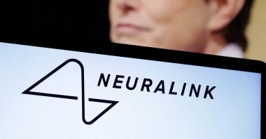 The Neuralink logo and a photo of Elon Musk are seen in this illustration taken Dec. 19, 2022. (Reuters File Photo)