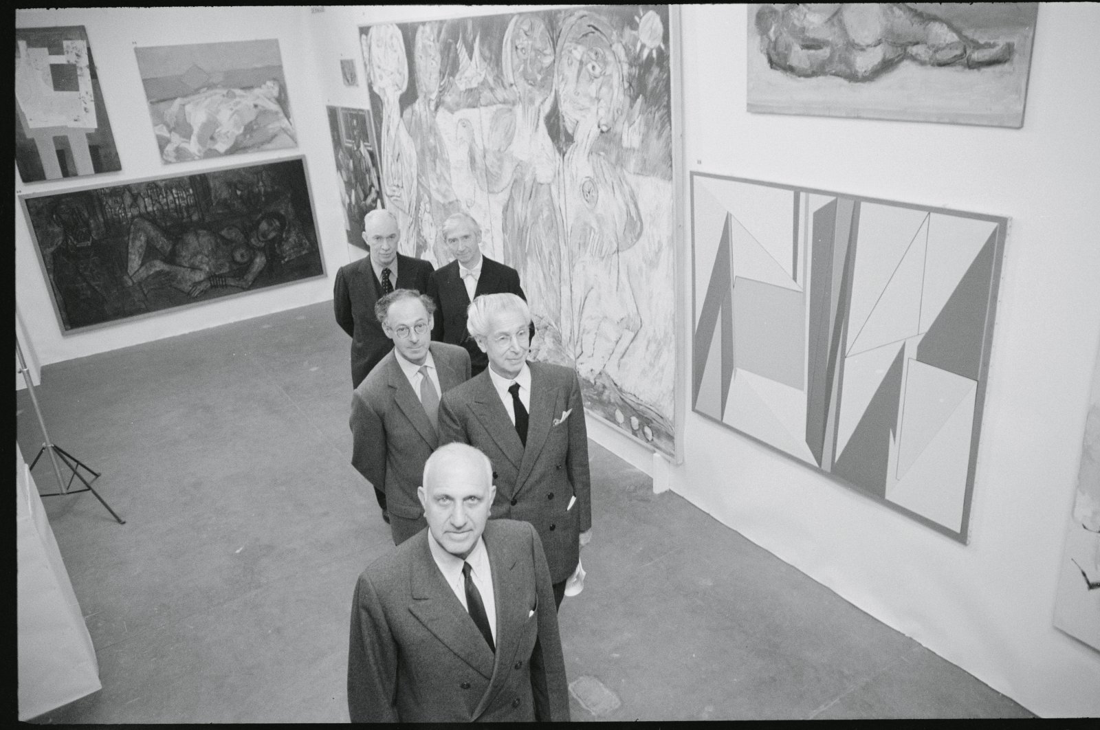 Front to back, Harry F. Guggenheim, president of the Solomon R. Guggenheim Foundation; Georges Salles, director-general of France&#039;s 666 Museums; painter Morris Kestleman; Sir Herbert Read, British art critic; and James Johnson Sweeney, Guggenheim Museum Director at the Manhattan Storage Company, New York, U.S., 1958. (Getty Images Photo)