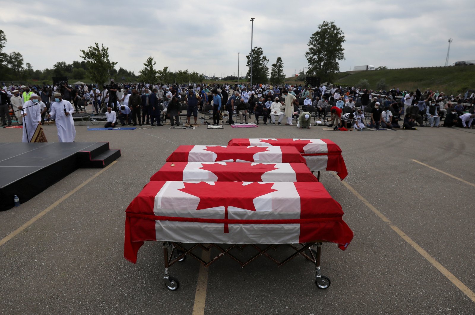 Flag-wrapped coffins are seen outside the Islamic Centre of Southwest Ontario, during a funeral of the Afzaal family that was killed in a terrorist attack, London, Ontario, Canada, June 12, 2021. (Reuters File Photo)