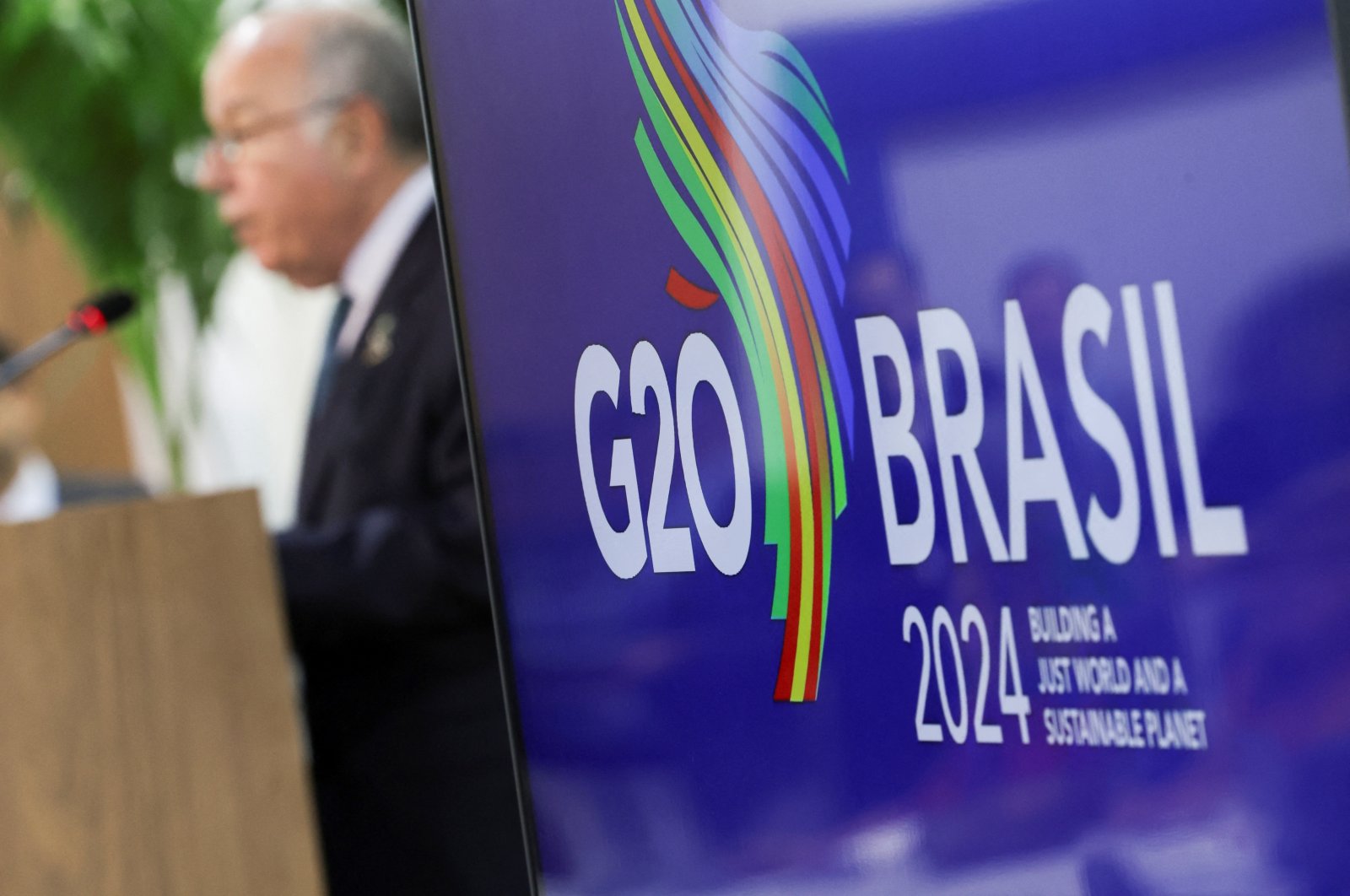 A logo of G-20 is displayed as Brazilian Foreign Minister Mauro Vieira speaks during a press conference following the G-20 Foreign Ministers&#039; Meeting, Rio de Janeiro, Brazil, Feb. 22, 2024. (Reuters Photo)