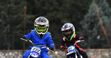 Child motorcyclists Rüzgar Ceyhan (L) and his younger brother Toprak Ceyhan during training, Bursa, Feb. 22, 2024. (AA Photo)

, Türkiye,