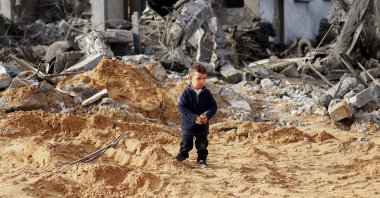 A Palestinian boy stands amid the ruins of a house, in Rafah, southern Gaza Strip, Palestine, Feb. 23, 2024. (Reuters Photo)