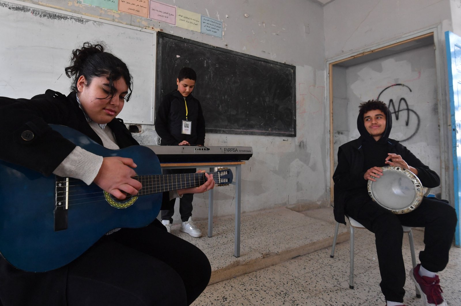 Students attend a music class financed by the after-school club Tunisia 88, at the Haffouz secondary school in Tunisia&#039;s northern Kairouan region. Feb. 2, 2024. (AFP Photo)